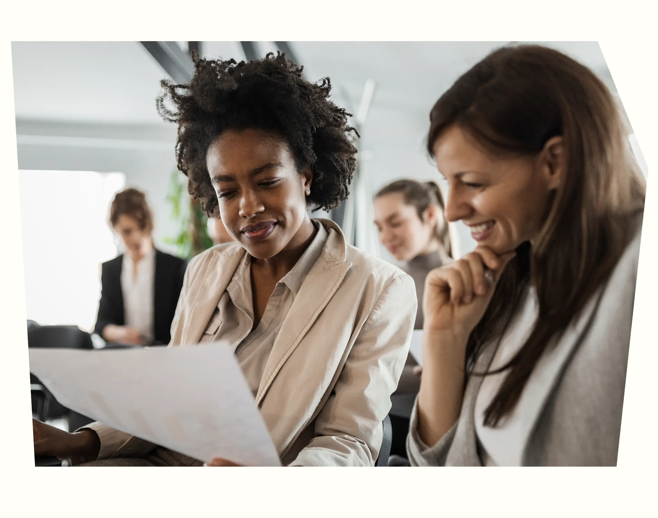 two HR professionals looking at results